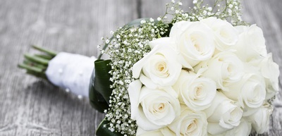 Wedding bouquet of white roses and baby's breath