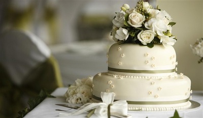 two tier wedding cake with rose topper