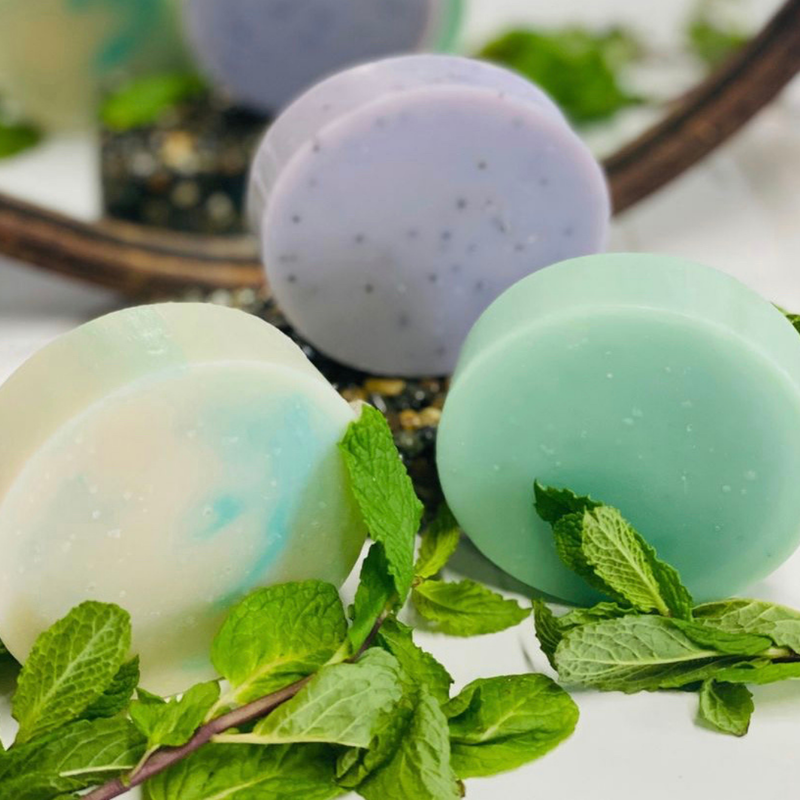 three different colors of soap